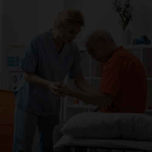 Patient care technician providing care to patient in her home